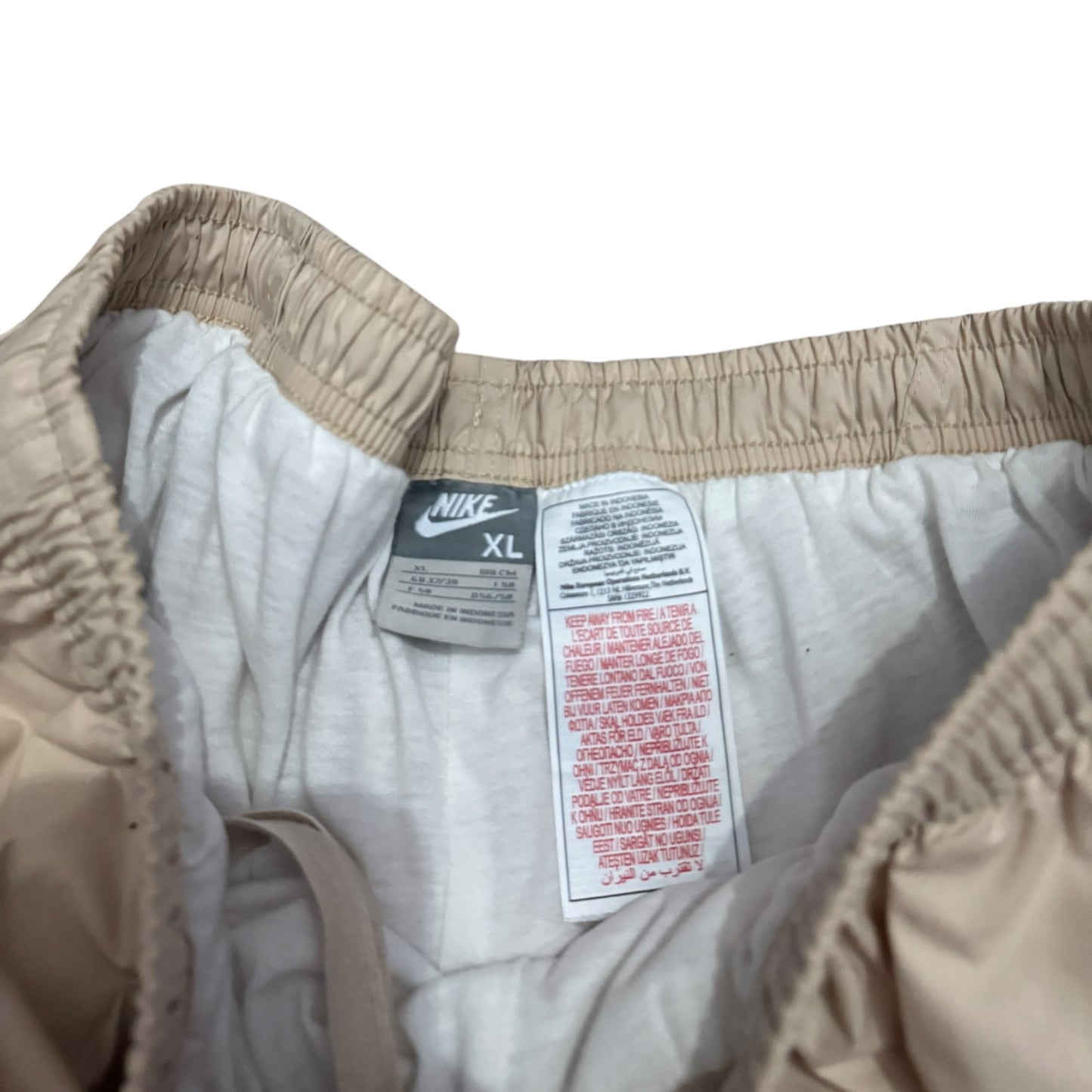 Beżowe spodnie męskie Nike parachute z szeroką nogawką vintage alternative rap drop